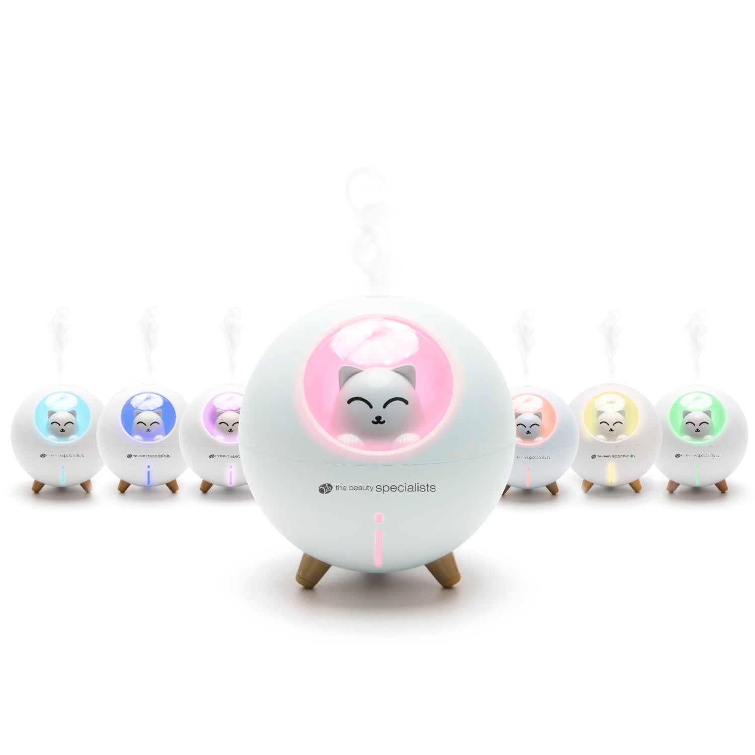 A row of Rio MIA Cat Children’s Essential Oil Diffusers, Humidifiers, and Night Lights glow in pastel colors, with the main egg-shaped unit in front emitting pink steam as a night-light. Each features a cat face inside.