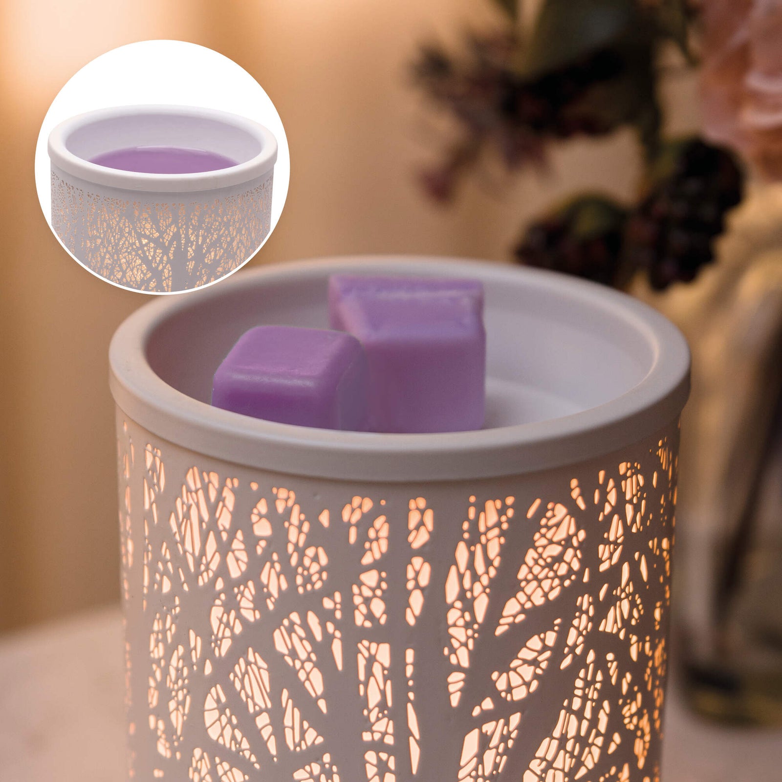 A Rio wax warmer with a glowing tree pattern holds Rio Scented Soy Wax Melts—Pack of 5 Fragrances. Purple melts rest on top, softly illuminated; an inset highlights the melted wax inside the decorative warmer.