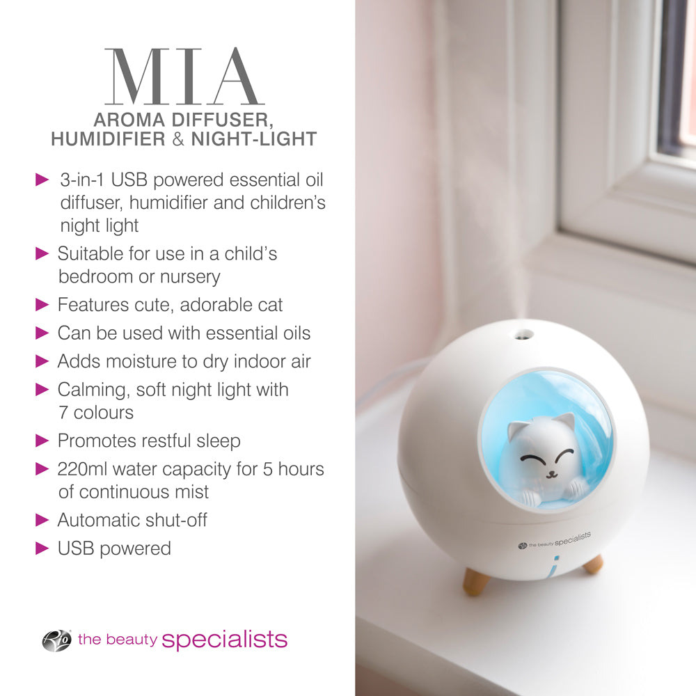 The Rio MIA Cat Childrens Essential Oil Diffuser, Humidifier, and Night Light sits on a windowsill. Features include USB power, 220ml capacity, automatic shut-off, child-safe design, and soothing 7-color lighting.