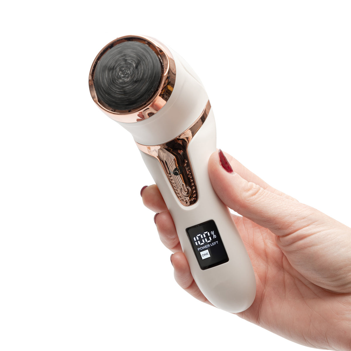 A hand with red nail polish holds the Rio Go Smooth Electric Foot File Hard Skin Remover with Vacuum Action, a white and rose gold device for removing hard skin—similar in look to a facial gadget but designed for smooth feet.