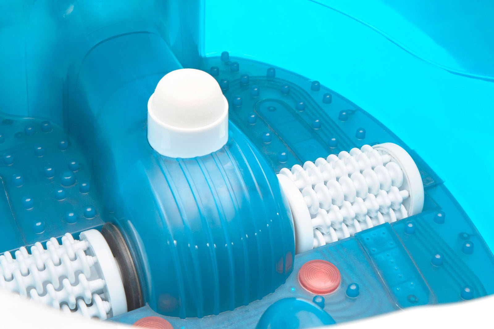 close up of inside of multi-functional motorised foot spa with massage rollers, red LED's and water jets visible