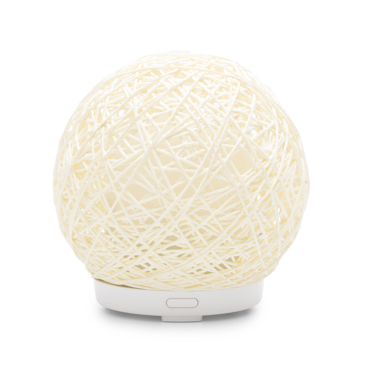 The Lola Aroma Diffuser, Humidifier, and Night Light by Rio features a spherical design with woven cream-colored string on a small white base, adding tranquility and style to any space against a plain white background.