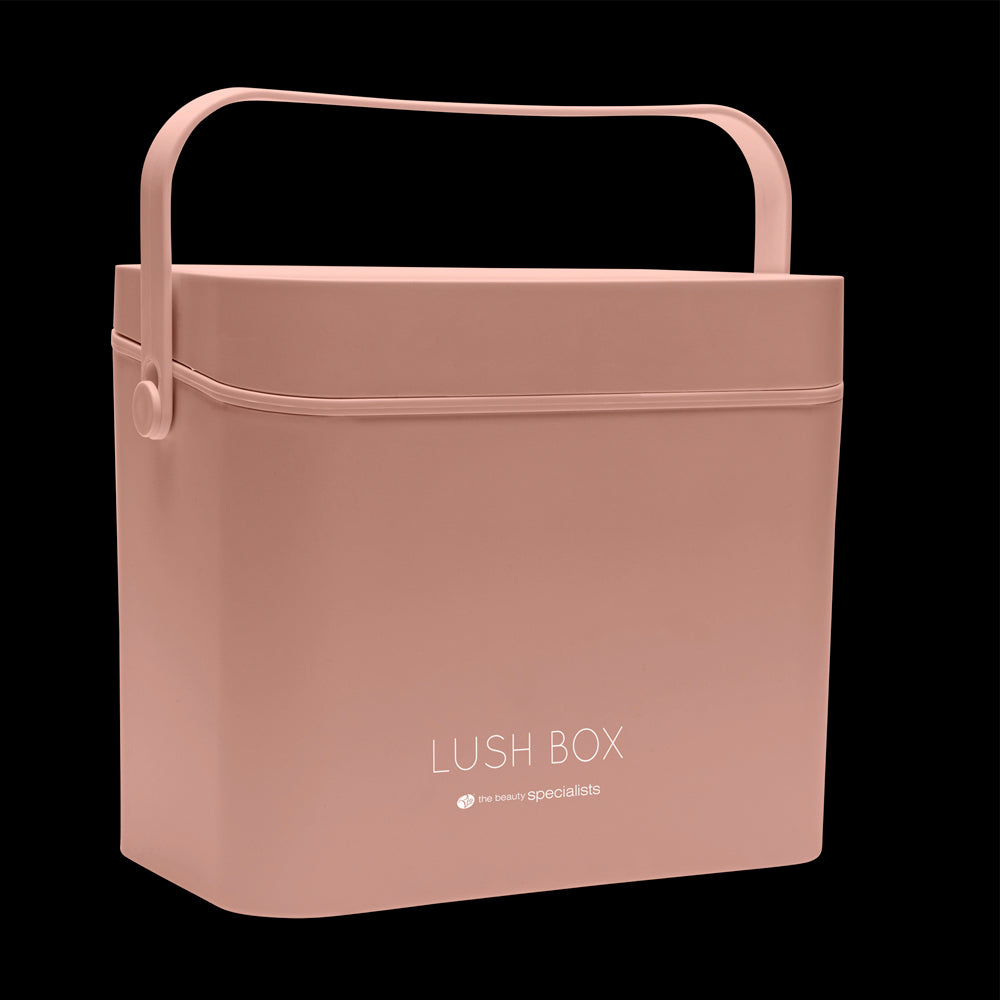 The Rio Lush Box Vanity Case - Large is a rectangular pink vanity with a handle, labeled “LUSH BOX The Beauty Specialists” on the front—ideal for beauty storage, shown against a black background.