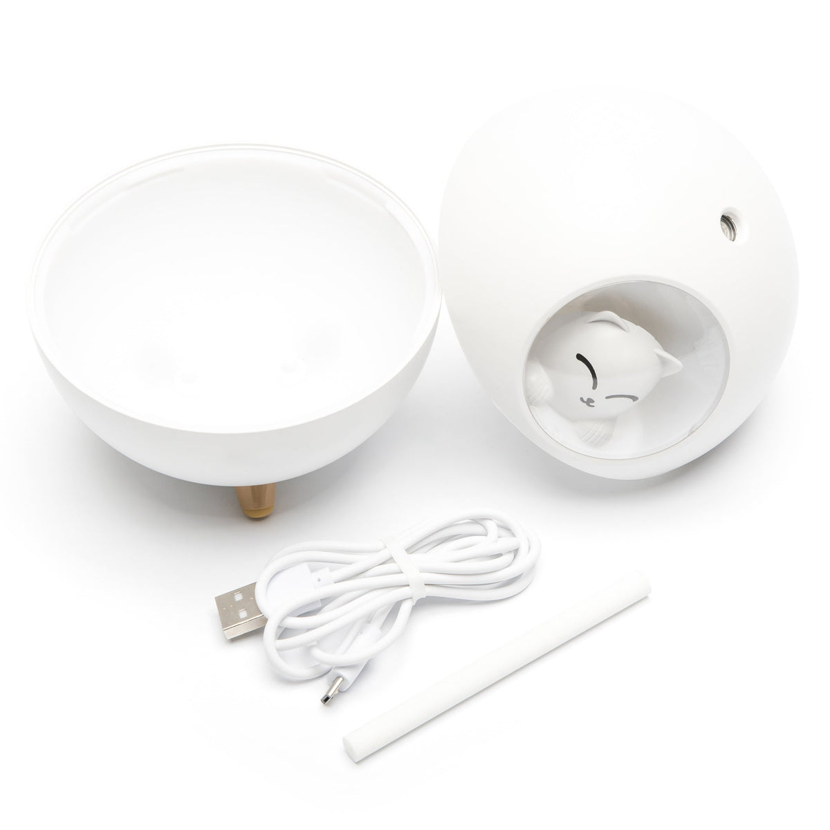 The Rio MIA Cat Childrens Essential Oil Diffuser, Humidifier, and Night Light is a white sphere that opens to reveal a cat figurine inside, with a USB cable and white stick included, all set against a white background.