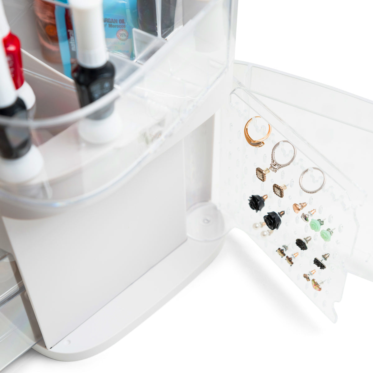 A close-up of the Rio Ultimate Beauty Storage Box With Dimmable Mirror, open to reveal rings and earrings neatly arranged on a transparent panel attached to the inside of the door.