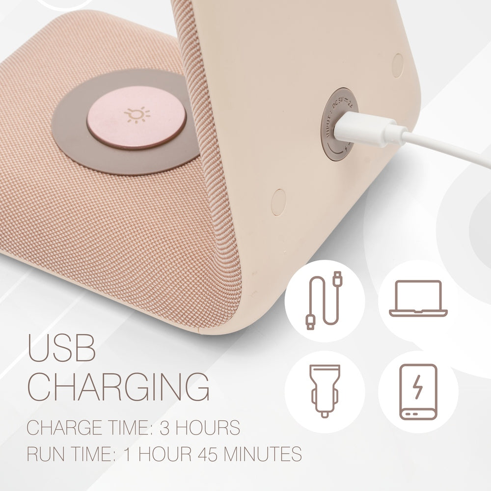 A close-up of the Rio TrueColour High Performance Makeup Mirror charging via USB highlights refined simplicity. Text reads: USB Charging. Charge time: 3 hours. Run time: 1h 45m. Icons show USB cable, adapter, laptop, and battery.