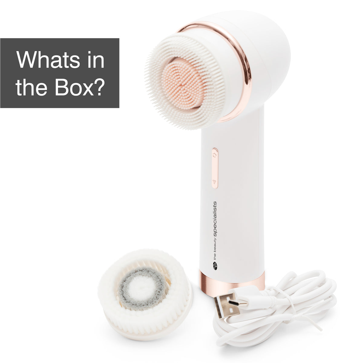 The PURE CLEANSE Deep Cleansing & Exfoliating Facial Brush by Rio the Beauty Specialists comes in white and rose gold, includes an extra brush head and USB charging cable. Gray box text: Whats in the Box? – your new skincare essential.