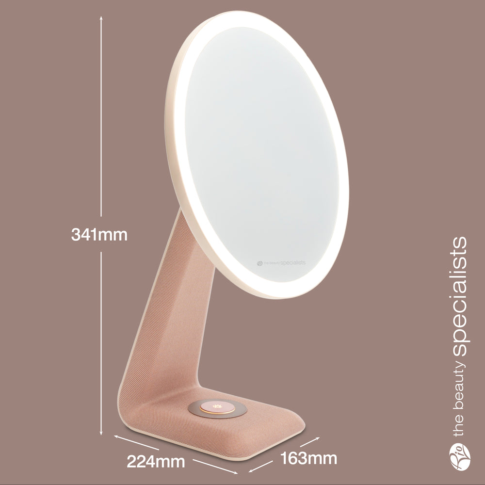 The Rio TrueColour High Performance Makeup Mirror features a modern oval LED design in rose gold with a touch button base, high-clarity reflection, and the Beauty Specialists logo on the side. Size: 341mm H x 224mm D x 163mm W.