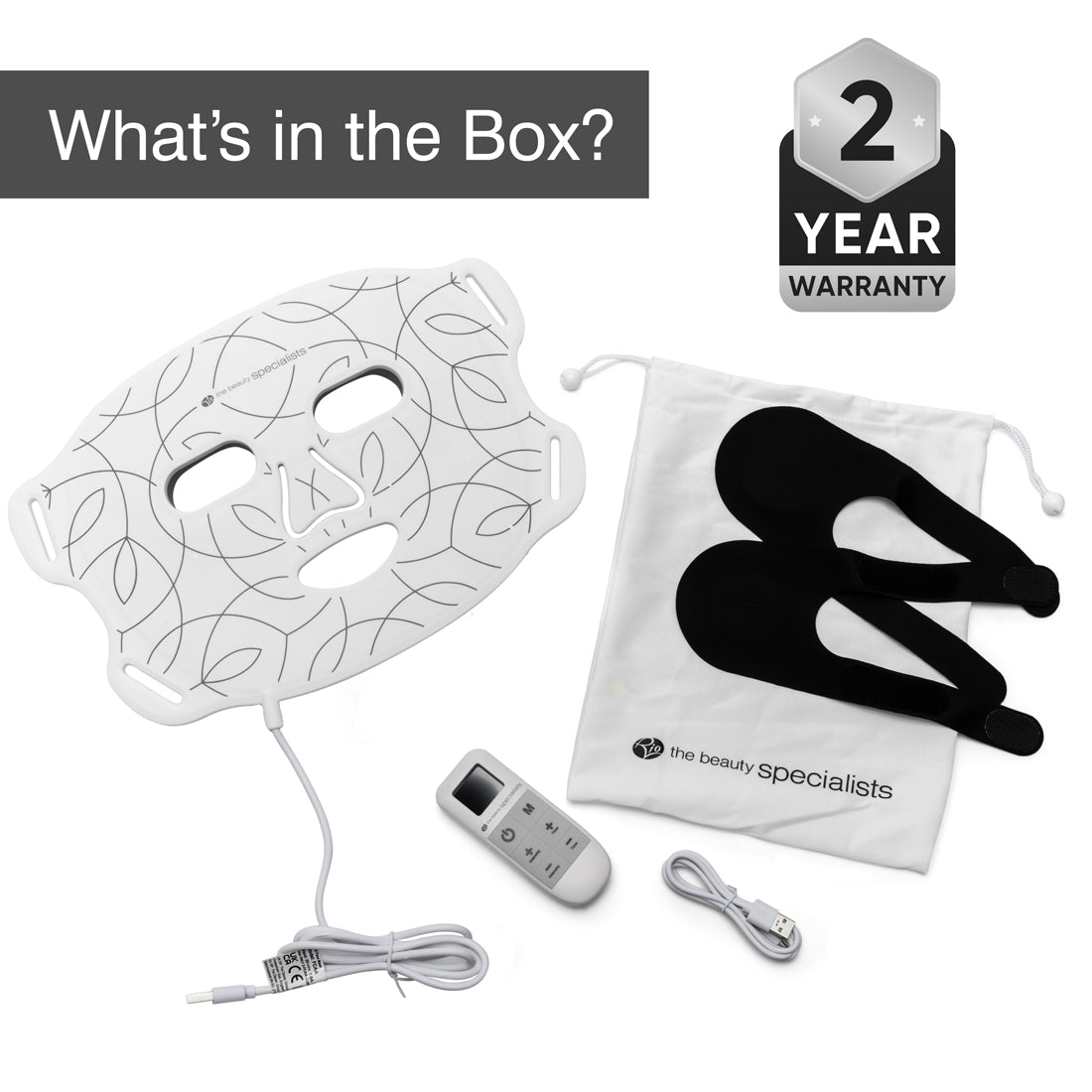 The Rio LED Face Mask by Rio, shown with black straps, remote control, USB cable, and white drawstring pouch on a white background. Text: What’s in the Box? and 2 Year Warranty.