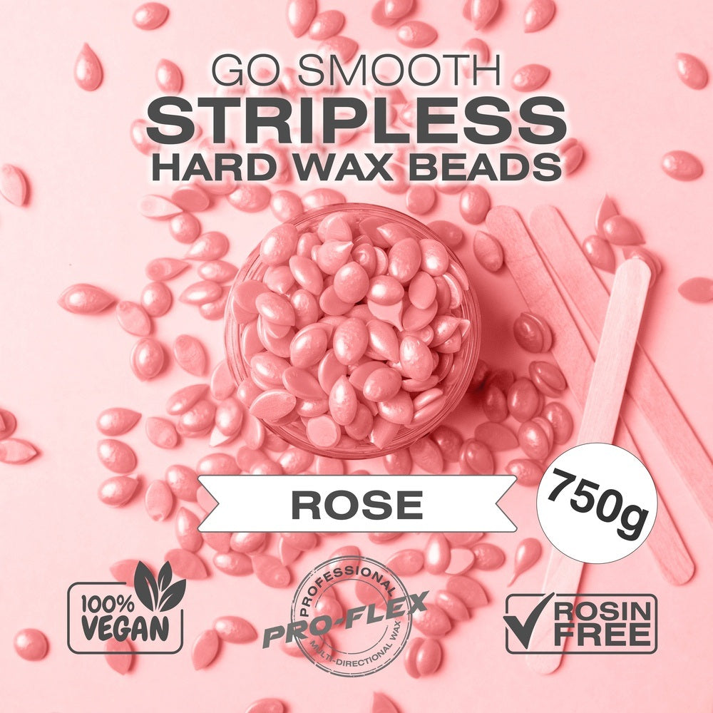 A glass bowl of pink Rio Rose Go Smooth Stripless Hard Wax Beads (750g) sits among loose beads and two wooden spatulas on a pink background. 100% vegan, pro flex, and rosin free for smooth skin.