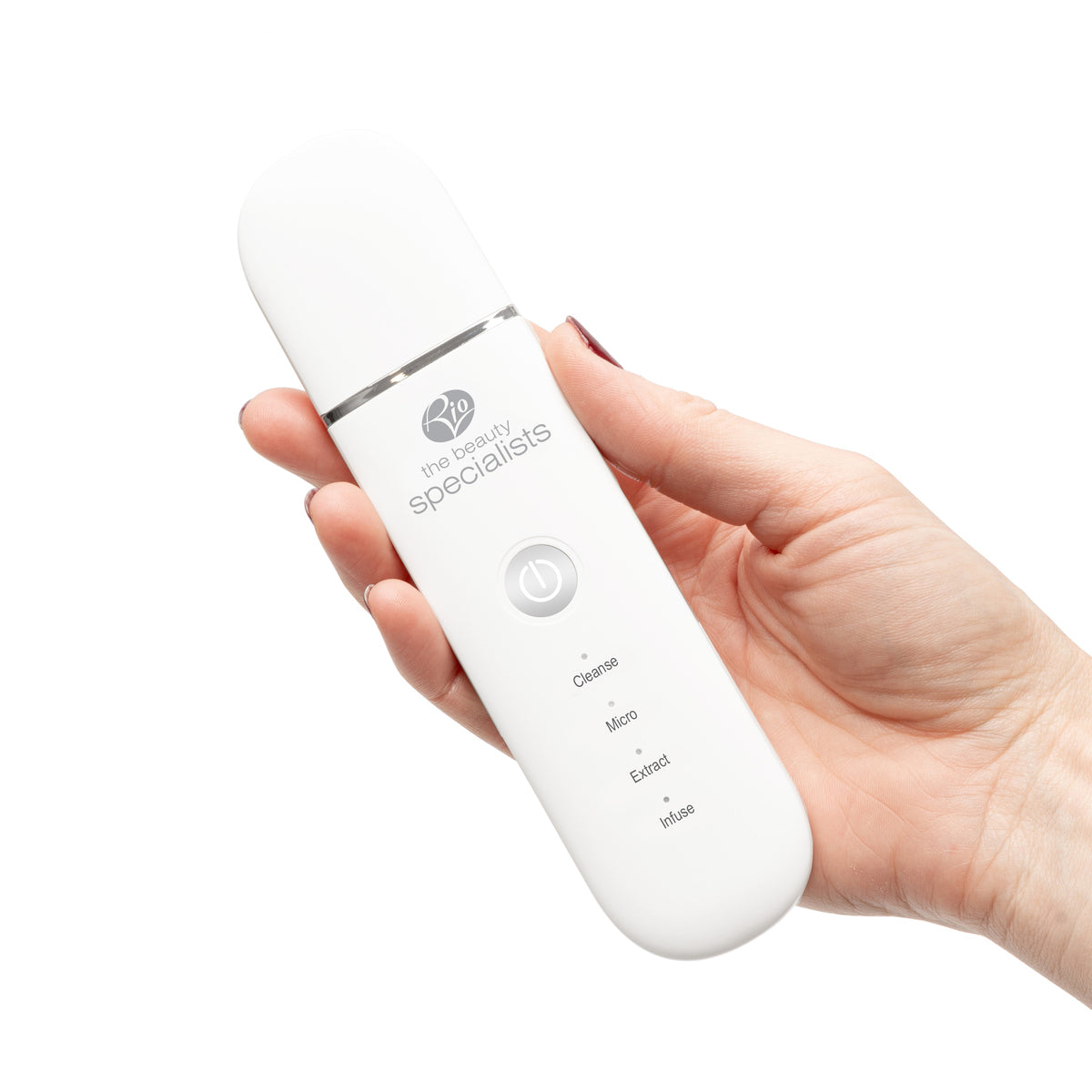 A hand holding the white Rio Ultrasonic Skin Cleanser, featuring buttons for Cleanse, Micro, Extract, and Infuse—designed for advanced exfoliation and deep skin cleansing routines.