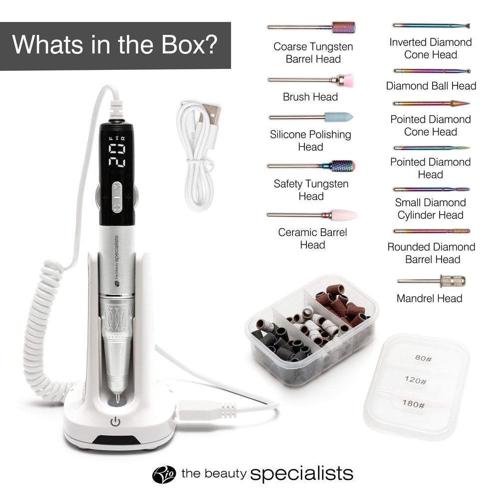 The Rio Salon Pro Electric Nail File & Drill kit includes a nail drill pen with display, charging stand, USB cable, sanding bands, bits storage case, and assorted drill heads—everything you need for salon-quality nail care.