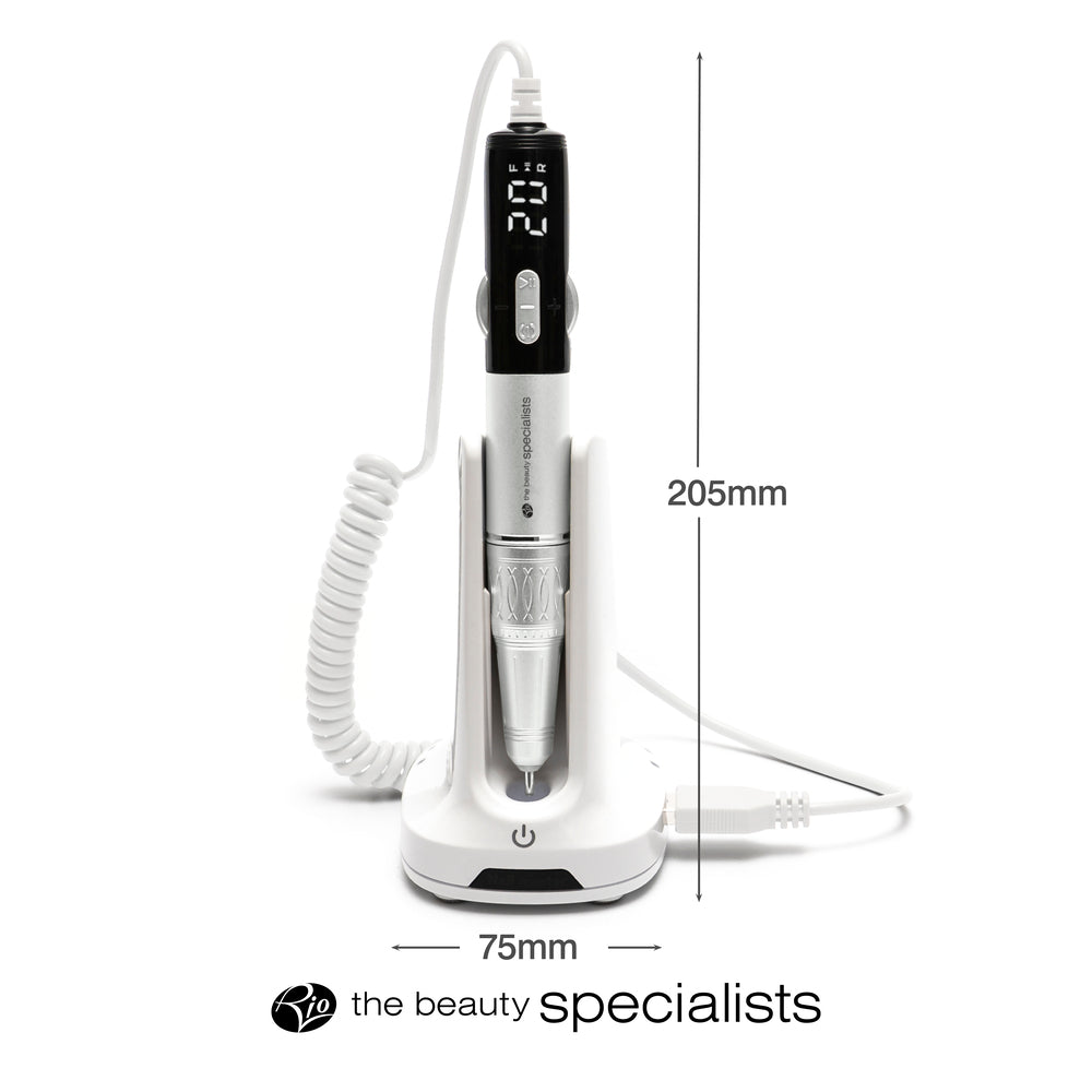 The Rio Salon Pro Electric Nail File & Drill stands upright in a white charging base with a display screen. It measures 205mm tall and 75mm wide, features a coiled white cord, and offers salon-quality care for DIY beauty. "The beauty specialists" text displayed.
