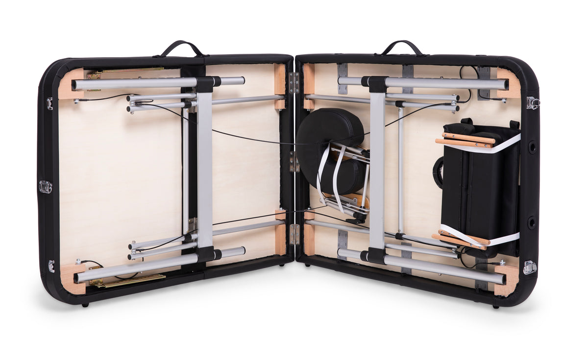 An open black carrying case reveals the Rio Professional Aluminium Massage Table & Treatment Couch, featuring padded sections, metal and wooden supports, and organized cables for easy at-home use.