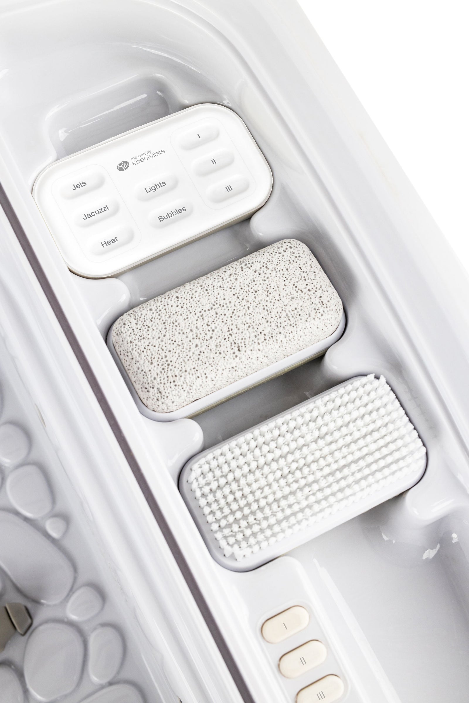 hand held remote, pumice stone and brush in handy built in compartment 