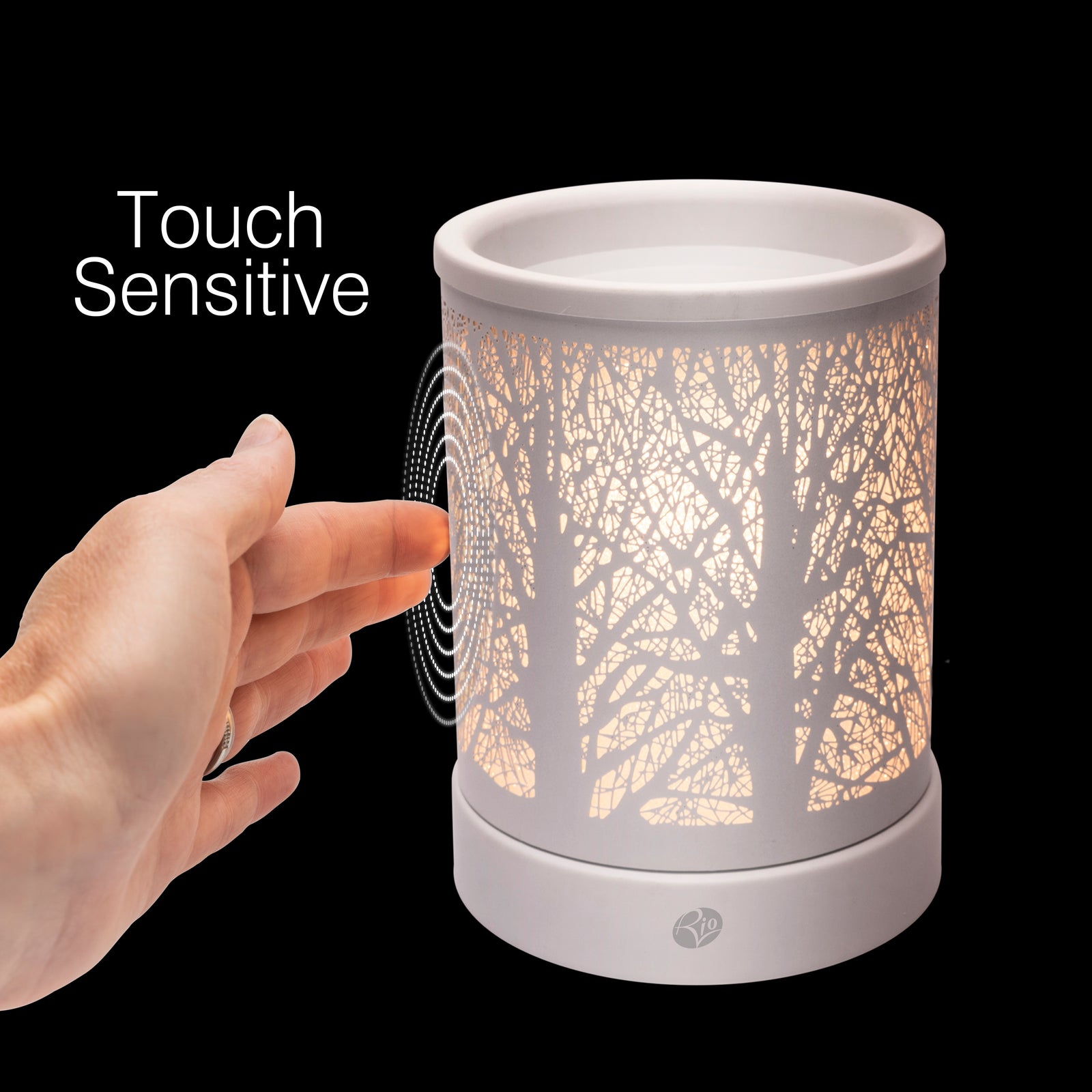 A hand reaches toward the Rio FORA Wax Melt Burner & Aroma Diffuser Lamp, its tree-branch design softly glowing. Touch Sensitive appears beside the lamp on a black background—relax with elegance and style.